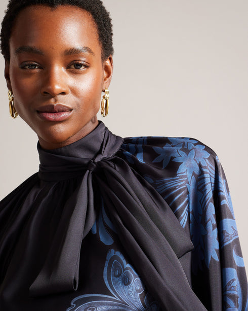 TESSAAH-Tops-When the evening calls for a nice top, TESSAAH is the go-to. Featuring our luxe gilded floral print and an oversized neck tie that brings drama to the silhouette, this blouse is both elegant and easy to wear. Satin blouse Blouson sleeves High neck Ombre gilded floral print Oversized neck tie Gathered neckline Zip fastening Silvia is 5'11" / 1.8m and wears Blue in a Ted size 1- Ted Baker Romania